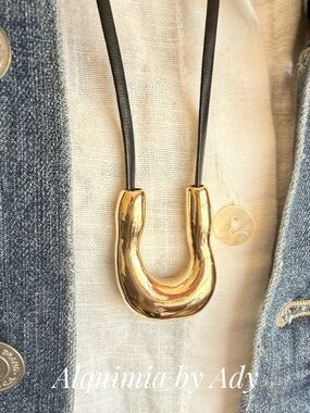 Alquimia Gold U-Shaped Pendant on Black Cord